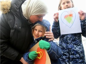 - Young Marilla Matthews, 6, gets a big kiss from Asmaa Shehata (a board member of the Ottawa Mosque) as her older sister, Quinn Matthews, 11, holds her heart sign beside her. "Thank you so much for coming. You're so sweet," said Ms. Shehata. People at the Ottawa Mosque were still reeling from the recent New Zealand terror attack on Friday (March 15, 2019), but took comfort by the support shown them from local politicians, police and members of the community, who came out to show their solidarity with the muslim community. Julie Oliver/Postmedia