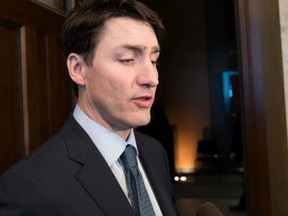 Prime Minister Justin Trudeau speaks to the press at Parliament Hill in Ottawa on Feb. 19, 2019.