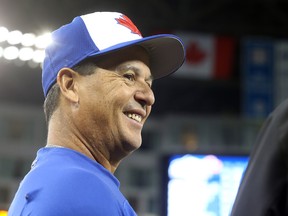 Blue Jays' manager Charlie Montoyo takes in batting practice ahead of Thursday's season opener. (DAVE ABEL/Toronto Sun)