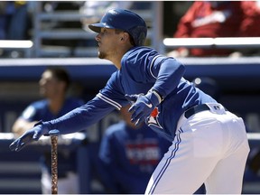 The Toronto Blue Jays' Cavan Biggio watches his home run off Philadelphia Phillies starting pitcher Vince Valasquez during the second inning of a spring training baseball game Wednesday, March 6, 2019, in Dunedin, Fla.