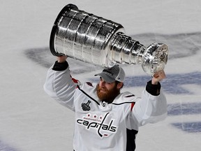 Braden Holtby #70 of the Washington Capitals hoists the Stanley Cup after his team's 4-3 win over the Vegas Golden Knights in Game Five of the 2018 NHL Stanley Cup Final at T-Mobile Arena on June 7, 2018 in Las Vegas, Nevada.