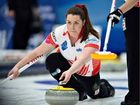 Canada's Dana Ferguson throws a stone in Saturday's opening match against South Korea in the women's world curling championship at Silkeborg, Denmark.