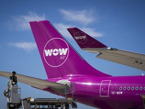 A file picture taken on August 6, 2018 shows an aircraft of Icelandic low-cost airline WOW Air on the tarmac of Roissy-Charles de Gaulle Airport, north of Paris. - Icelandic low-cost airline WOW Air, in difficult financial position, announced on March 28, 2019 that it will cease operations and cancel all flights, a decision that is expected to affect thousands of passengers.