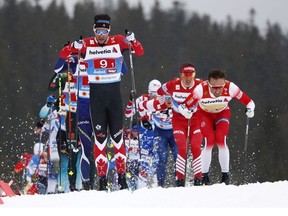 Canada's Alex Harvey, left, competes in a men's cross country 4x10km relay, at the Nordic ski World Championships in Seefeld, Austria, Friday, March 1, 2019.