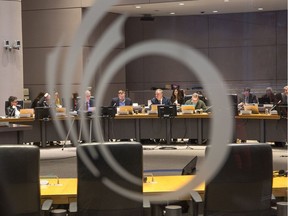 City councillors are seen behind the main entrance to Andrew Haydon Hall.