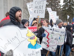 Teachers shout slogans as nearly 300 teachers, parents of autistic children, unionists and a variety of supporters gathered outside the Walter Baker Sports Centre in Barrhaven to protest Doug Ford and area Conservative party supporters who were attending a spaghetti supper and fundraiser.