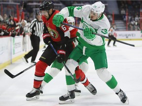 Ottawa Senators defenceman Ben Harpur (67) and Toronto Maple Leafs centre Auston Matthews (34) battle during first period NHL hockey action in Ottawa on Saturday, March 16, 2019 .