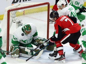 Toronto Maple Leafs goaltender Garret Sparks makes a save as Ottawa Senators left-winger Brady Tkachuk and Toronto Maple Leafs defenceman Morgan Rielly look on during the third period at the CTC on Saturday, March 16, 2019.