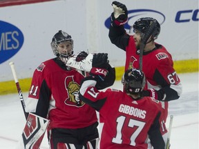 Ottawa Senators defenceman Ben Harpur (right) and left wing Brian Gibbons congratulate goaltender Craig Anderson after the Senators defeated the Toronto Maple Leafs 4-2 at the CTC on Saturday, March 30, 2019.