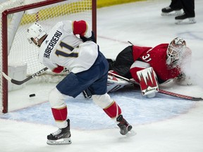 The Florida Panthers' Jonathan Huberdeau scores on a sprawling Ottawa Senators goaltender Anders Nilsson during the second period on Thursday, March 28, 2019.