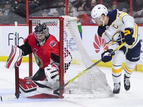 Buffalo Sabres centre Jack Eichel attempts to wrap the puck around the net on Ottawa Senators goaltender Craig Anderson during the second period on Tuesday, March 26, 2019.
