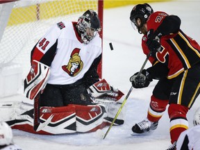 Ottawa Senators goalie Craig Anderson stops a shot from the Calgary Flames' Elias Lindholm during the third period on Saturday.