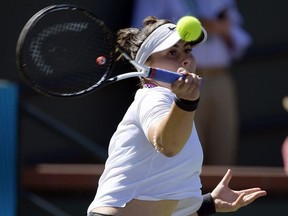 Bianca Andreescu, of Canada, returns a shot to Bianca Andreescu, of Canada, at the BNP Paribas Open tennis tournament Wednesday, March 13, 2019, in Indian Wells, Calif.