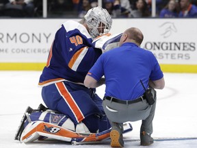 A trainer tends to New York Islanders goaltender Robin Lehner after he was laid out in a collision with the Ottawa Sentors' Brady Tkachuk during the third period on Tuesday, March 5, 2019, in Uniondale. Lehner won't be available for the rematch in Ottawa.