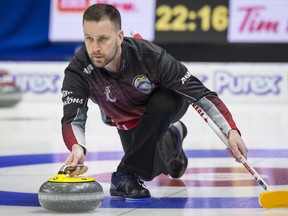 Team Canada skip Brad Gushue makes a shot during the sixth draw against team British Columbia at the Brier in Brandon, Man. Monday, March, 4, 2019. THE CANADIAN PRESS/Jonathan Hayward