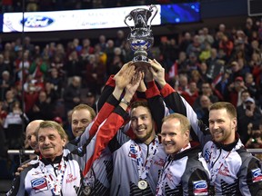 Team Canada hoisting the trophy, skip Brad Gushue, Mark Nichols, Brett Gallant, Geoff Walker, coach Jules Owchar and alternate Tom Sallows after defeating Sweden 4-2 in the gold medal draw during of the World Men's Curling Championship at Northlands Coliseum in Edmonton, Monday, April 9, 2017. (Ed Kaiser/Postmedia Network)
