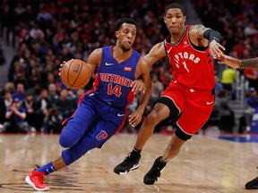Detroit Pistons guard Ish Smith drives against Toronto Raptors guard Patrick McCaw during the first half of an NBA game, Sunday, March 3, 2019, in Detroit.