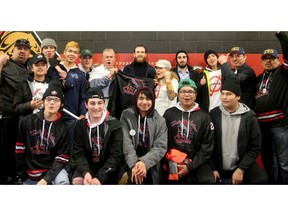 NHLer Ryan O'Reilly (rear centre) meets with the entire First Nation Elites Bantam AAA hockey team at Canadian Tire Centre Thursday after practice.