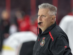 Interim head coach Marc Crawford watches a play during practice as the Ottawa Senators make the decision to replace Coach Guy Boucher with Marc Crawford.  Photo by Wayne Cuddington/ Postmedia