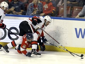 Defenceman Christian Wolanin tries to control the puck during a March 3 game against the Panthers in Sunrise, Fla.