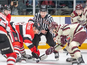 67’s forward Sasha Chmelevski (left) and Peterborough Petes forward Semyon Der-Arguchintsev line up for a faceoff during Friday night’s game in Ottawa. The hosts can set a franchise record for points in a season on Sunday. (Valerie Wutti/Photo)