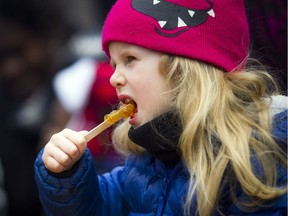 Four-year-old Charlotte Natynczyk enjoyed the taffy at the 35th edition of the Vanier Sugar Fest on Saturday, April 6, 2019.