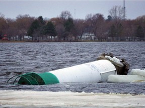 On Saturday morning, the lighthouse at the Pembroke Marina was still bobbing in the Ottawa River, lying on a rock shoal