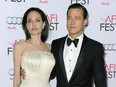 In this Nov. 5, 2015 file photo, Angelina Jolie, left, and Brad Pitt arrive at the 2015 AFI Fest opening night premiere of "By The Sea" in Los Angeles.