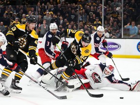 Bruins’ Brad Marchand dives as he shoots against the Blue Jackets in Game 1. The Bruins won the game overtime.  Getty Images