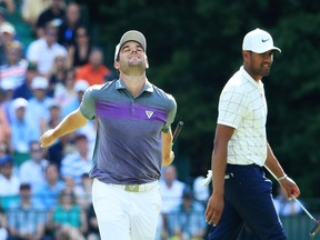 Corey Conners of Canada reacts to a putt on the 15th green during the third round of the Masters at Augusta National Golf Club on Sunday. Andrew Redington/Getty Images)