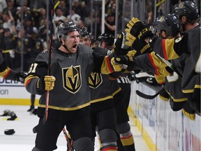 Mark Stone #61 of the Vegas Golden Knights celebrates with teammates on the bench after scoring a third-period goal, his third goal of the game, against the San Jose Sharks in Game Three of the Western Conference First Round during the 2019 NHL Stanley Cup Playoffs at T-Mobile Arena on April 14, 2019 in Las Vegas, Nevada. The Golden Knights defeated the Sharks 6-3 to take a 2-1 lead in the series.