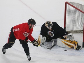 Senators forward Mikkel Boedker gets stopped by goalie Joey Daccord during a drill at Senators practice on Tuesday.
