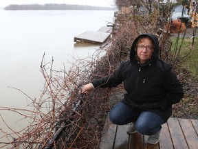 Sylvie Goneau, seen at the edge of her property along the Ottawa River on April 20, 2019, is concerned about flooding.
