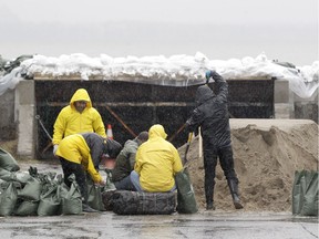 As the Ottawa River kept rising Friday, volunteers were sandbagging vulnerable points around Britannia Bay, remembering the last flood in 2017 all too vividly.