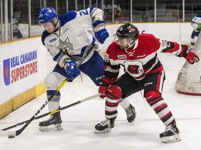 The Ottawa 67's Lucas Chiodo battles for a loose puck with the Sudbury Wolves' Emmett Serensits in Game 1 on Friday, April 5, 2019. Chiodo had three goals and a four-point night, but producing big numbers against Sudbury is nothing new for the 67's player.