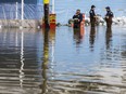 Gatineau firefighters collect data in rising flood waters on Rue Saint Louis in Gatineau,