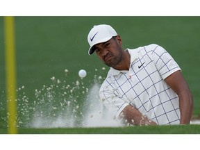 Tony Finau hits from a bunker on the second hole during the third round for the Masters golf tournament Saturday, April 13, 2019, in Augusta, Ga.