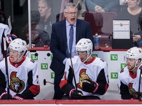Senators interim head coach Marc Crawford gets into a game against the Vancouver Canucks in March. (Darryl Dyck/The Canadian Press)