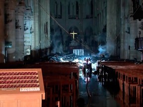 This image taken from France Televisions video shows the fire damage inside the Notre Dame cathedral in Paris, Monday April 15, 2019. Firefighters declared success Tuesday morning in an over 12-hour battle to extinguish an inferno engulfing Paris' iconic Notre Dame cathedral that claimed its spire and roof, but spared its bell towers.