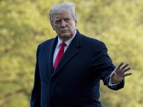U.S. President Donald Trump waves to members of the media as he walks on the South Lawn as he arrives at the White House in Washington, Monday, April 15, 2019, after visiting Minnesota.