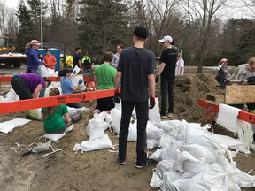 Volunteers in Cumberland worked from 8 a.m. to 6 p.m. building sandbag walls around homes just metres from the Ottawa River.