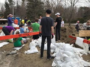 Volunteers in Cumberland worked from 8 a.m. to 6 p.m. building sandbag walls around homes just metres from the Ottawa River.