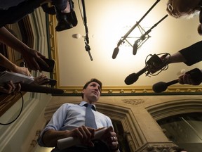 Prime Minister Justin Trudeau speaks with media before caucus on Parliament Hill in Ottawa, Wednesday, April 3, 2019. THE CANADIAN PRESS/Adrian Wyld
