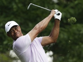 Tiger Woods hits from the fourth tee during the third round for the Masters golf tournament Saturday, April 13, 2019, in Augusta, Ga.