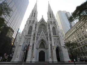 This Sunday, Aug. 30, 2015 file photo shows the newly renovated and cleaned facade of St. Patrick's Cathedral in New York.
