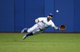 Former Blue Jays outfielder Kevin Pillar makes one of his patented catches. VERONICA HENRI/TORONTO SUN FILE