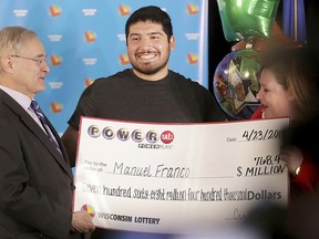 Manuel Franco of West Allis, Wis., winner of second-highest Powerball lottery in history, attends a news conference at the Wisconsin Department of Revenue in Madison, Wis., on Tuesday, April 23, 2019. (John Hart/Wisconsin State Journal via AP)