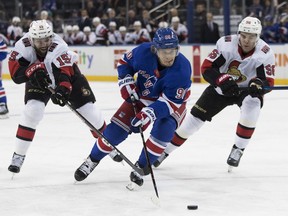 New York Rangers center Vladislav Namestnikov skates against Ottawa Senators left wing Zack Smith and left wing Magnus Paajarvi during the second period of an NHL hockey game, Wednesday, April 3, 2019, at Madison Square Garden in New York.