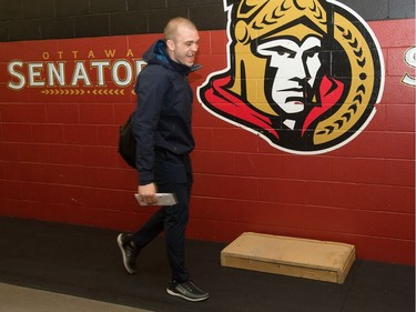 Marc Borowiecki walks past the Sens logo as the Ottawa Senators wrap up their season by clearing out their lockers and head home.