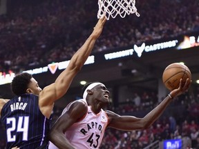 Magic centre Khem Birch (left) tries to stop Pascal Siakam of the Raptors in Game 2. THE CANADIAN PRESS